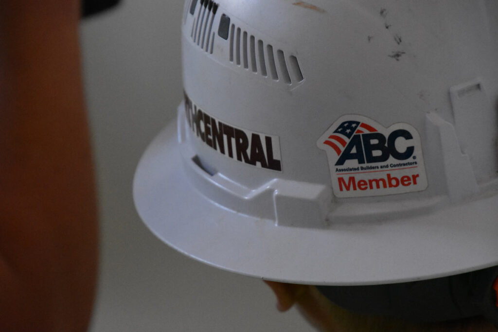 close up of hard hat with abc member sticker