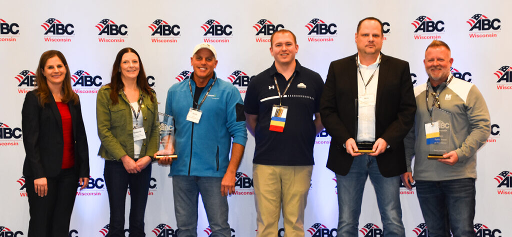 Accepting the Safety Awards of Excellence are from left to right are Jessie Cannizzaro of Milestone Plumbing (ABC of WI Board Chair); Kimberly Schaefer and Randy Smith of Koppers Railroad Structures; Tanner Wood and Mick Hintz of Horizon Construction Group and Mike Schulz of M3 Insurance (accepting for Gerald Nell, Inc.).